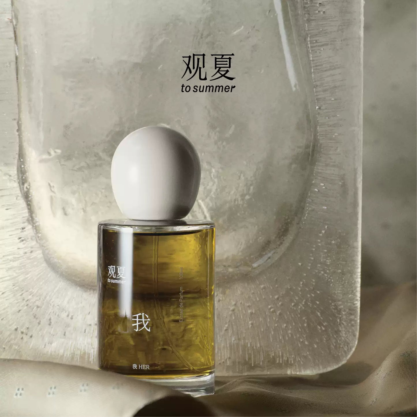 To Summer HER perfume bottle against icy texture background, symbolizing pure and fresh skin scents.
