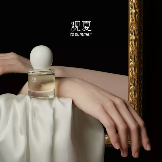 Elegant model posing with To Summer PEARL BOX perfume, showcasing old money aesthetic and quiet luxury style.
