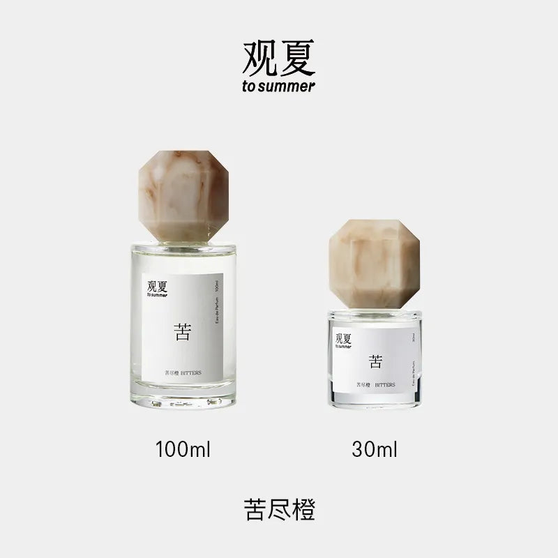 Two sizes of To Summer BITTERS perfume (100ml and 30ml), perfect aromatic gift set for fragrance lovers.
