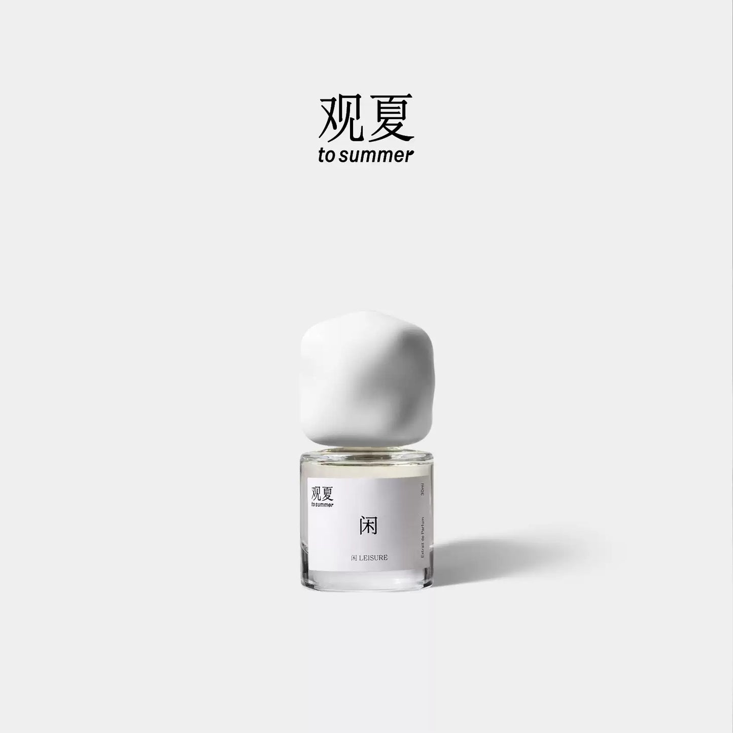 To Summer LEISURE niche perfume bottle with white cap, featuring a relaxing woody scent design.