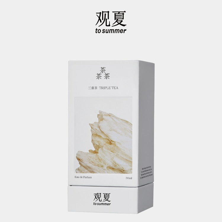 To Summer Triple Tea perfume packaging box with Chinese text and golden mountain artwork on a white background.