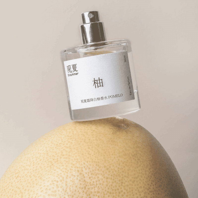 To Summer POMELO perfume spray in action, an uplifting scent for clarity and focus.